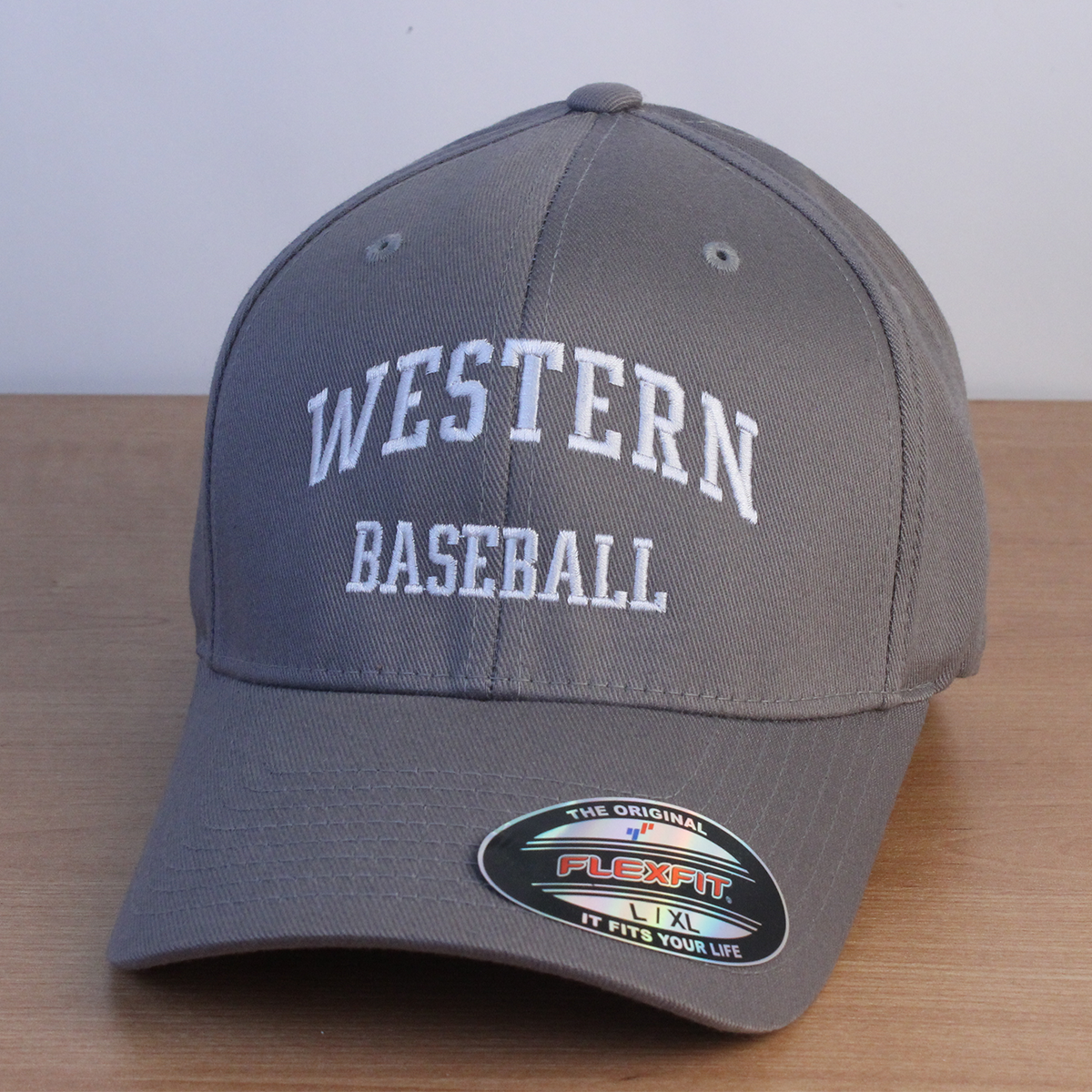 Grey ball cap with Western Baseball embroidered on the front in white lettering.
