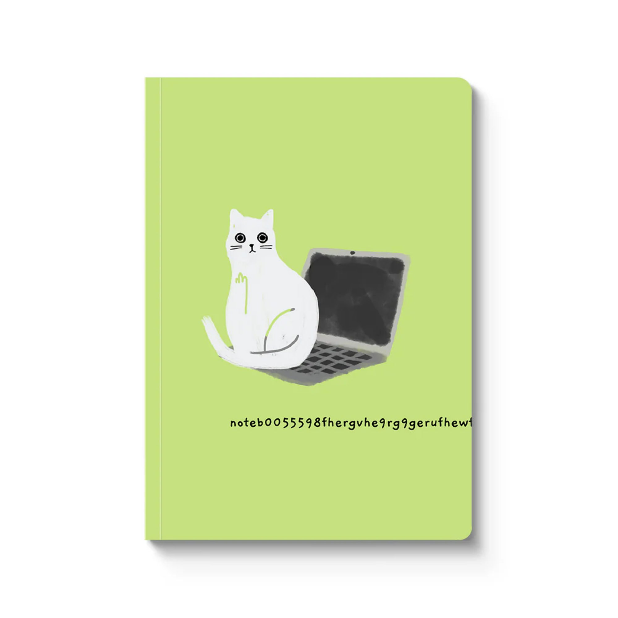 green notebook with white cat sitting on black laptop 