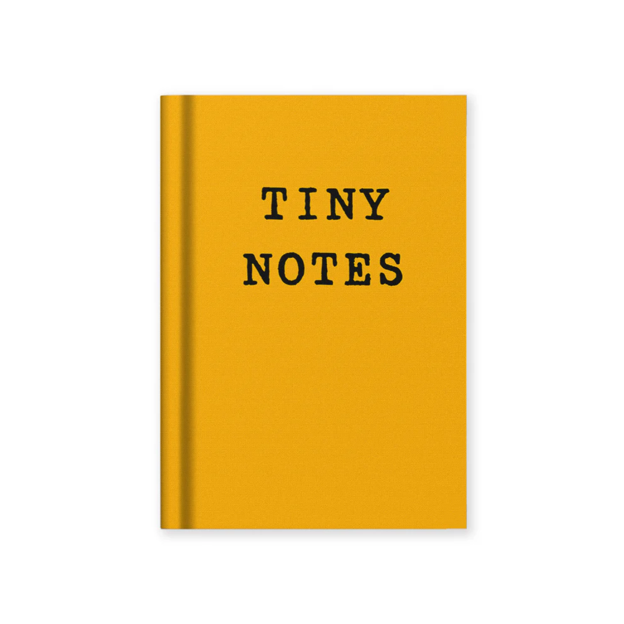 Yellow notebook with black text 'tiny notes'