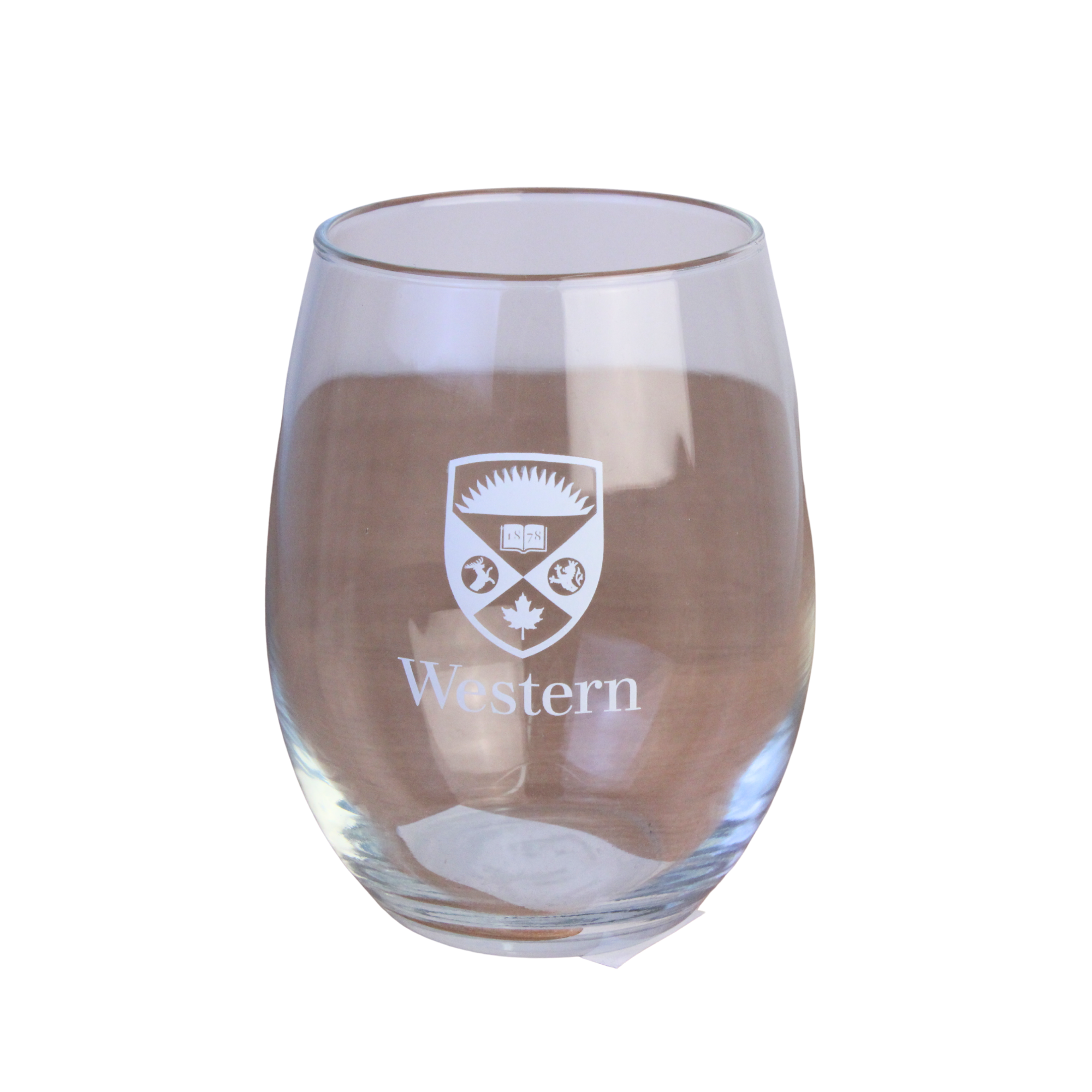 Stemless wineglass with the Western Crest logo engraved on the front.