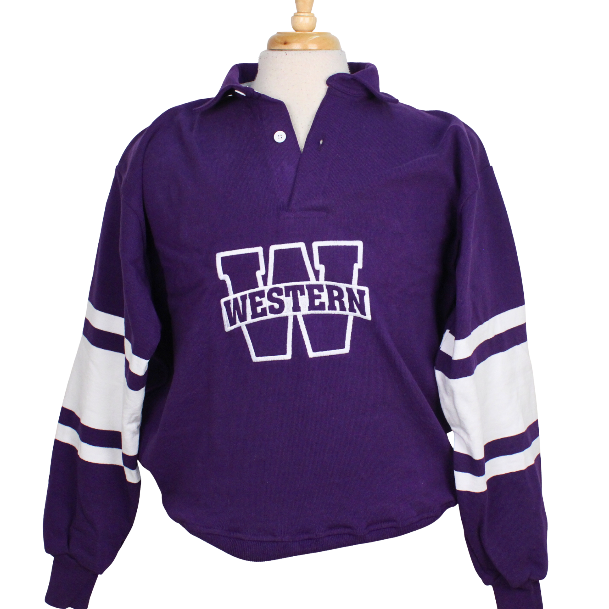 Rugby long sleeve shirt with purple an white stripes along the sleeves. Buttoned collar and cuffed sleeves. "Western W" graphic on the front of the shirt. 