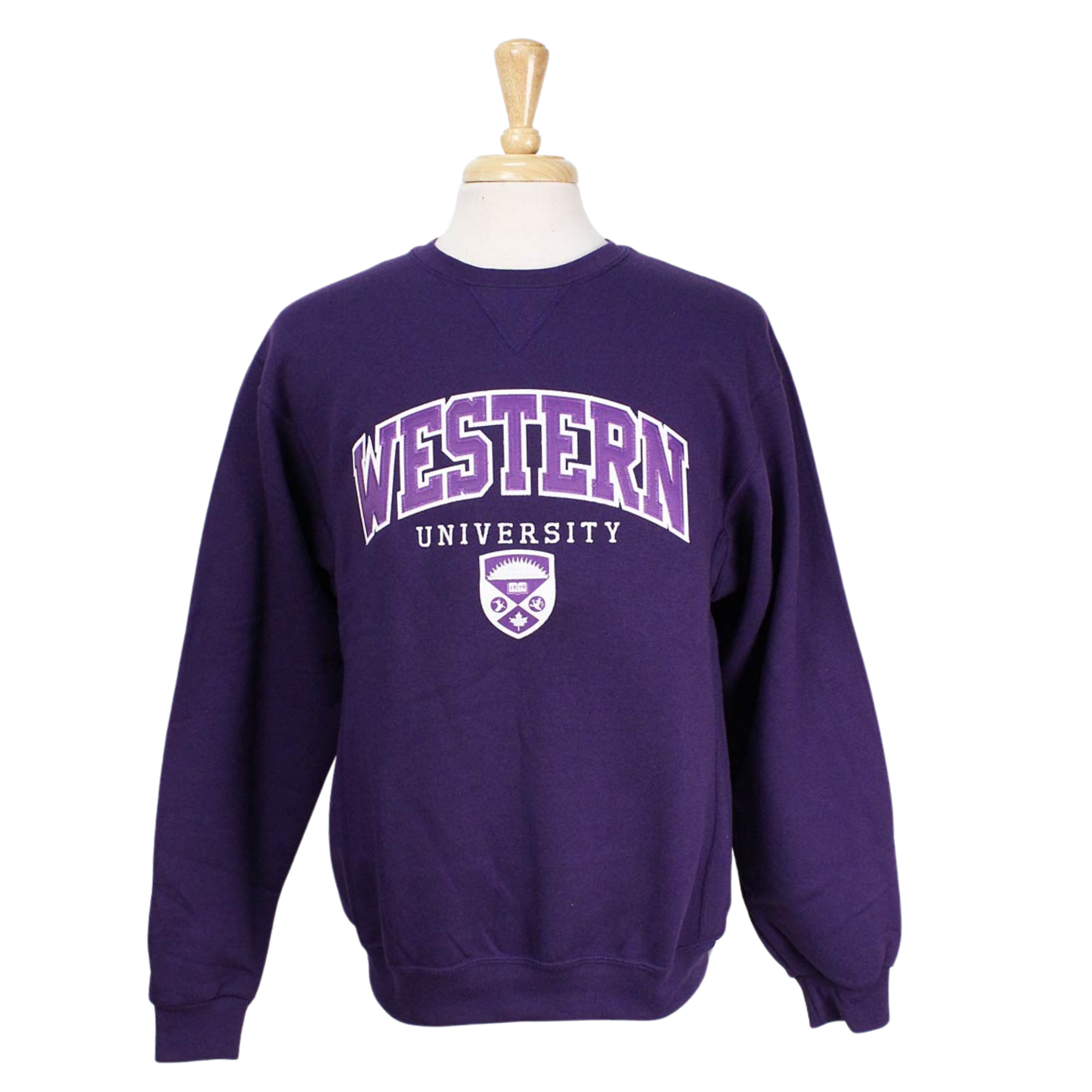 Purple crew neck. Appliqued 'Western' twill font, sublimated crest and embroidered 'University' in white and purple.