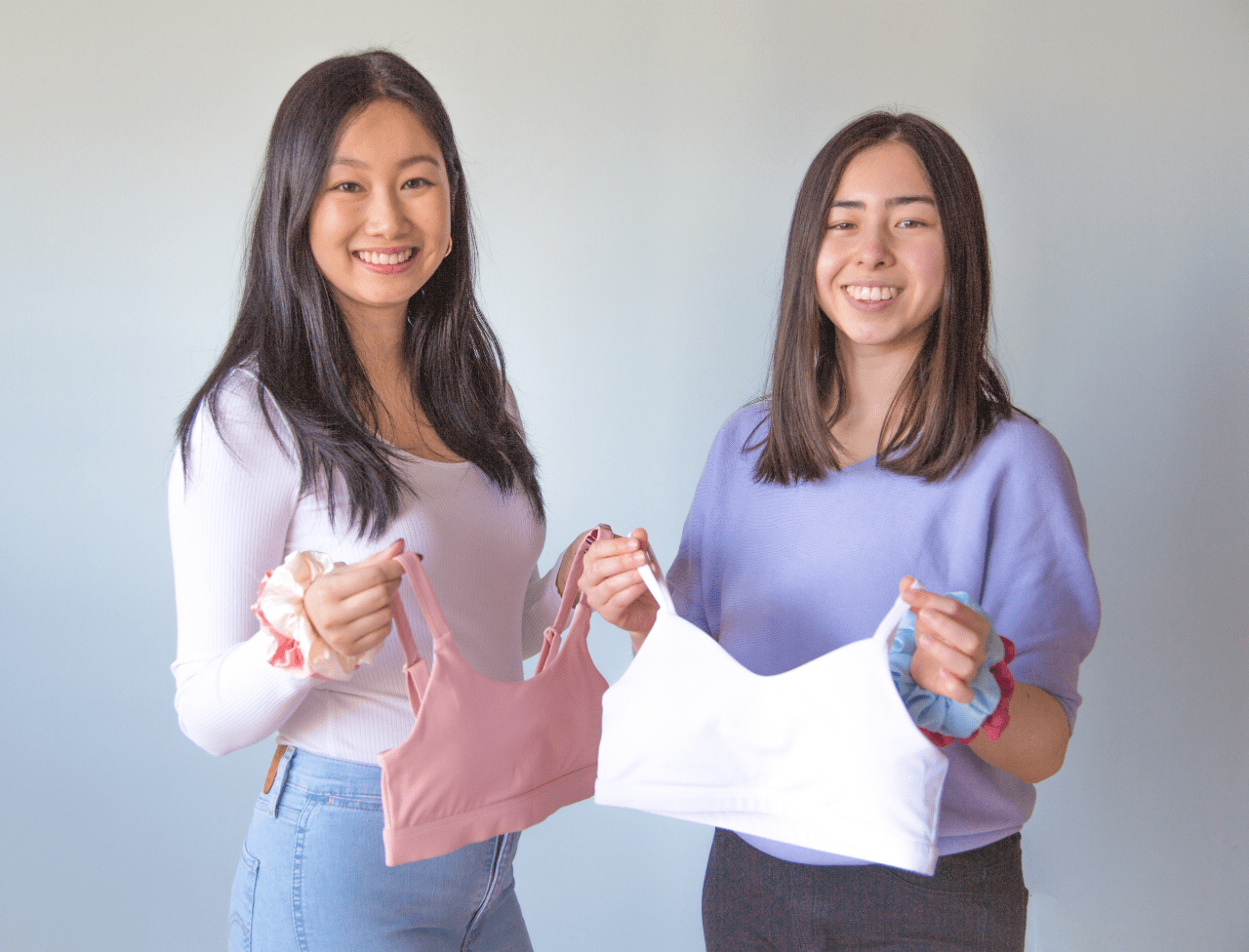 Apricotton founders holding up training bras