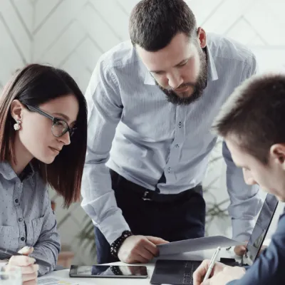 Three people meeting at a table