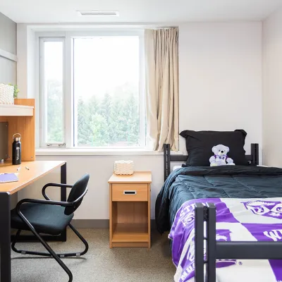 A residence room with Western branded sheets and products