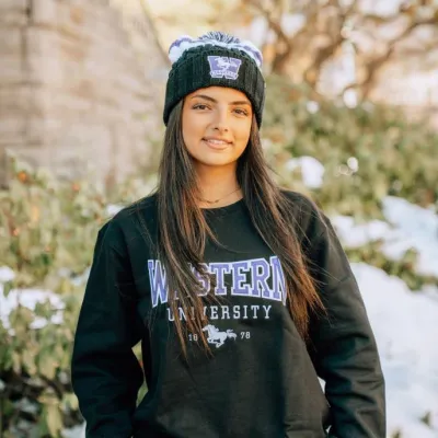 Student in Western crewneck and Toque