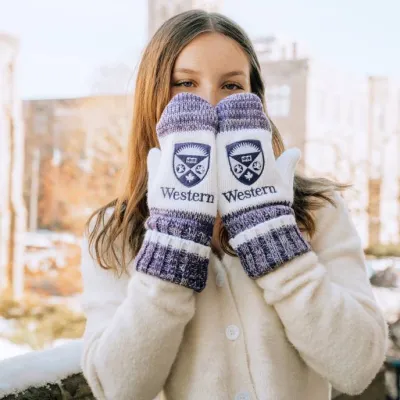 Western student in cardigan and mittens