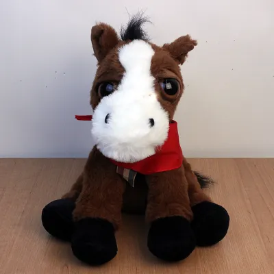Brown and white horse plush with red bandana.
