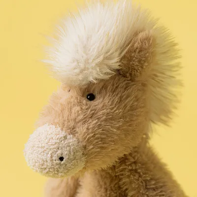 Beige horse with a suspiciously mullet hairstyle