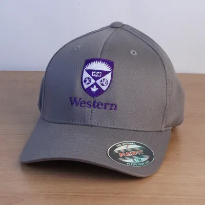 Grey ball cap with a purple and white embroidered Western Crest on the front. 