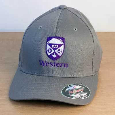Grey ball cap with a purple and white embroidered Western Crest on the front. 