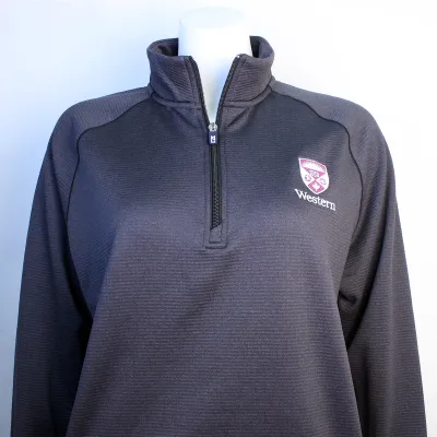 Black heather textured quarter zip long sleeve with the Western Crest and script on the left chest.