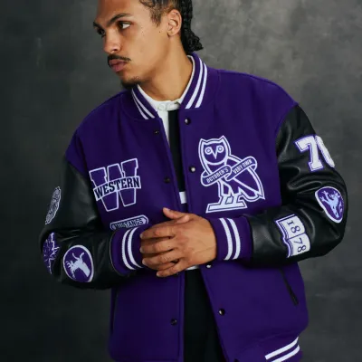Purple Varsity jacket with leather black sleeves and embroidered patches.
