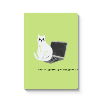 green notebook with white cat sitting on black laptop 