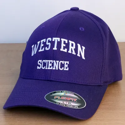 Purple ball cap with Western Science embroidered in white on the front. L/XL sizing.