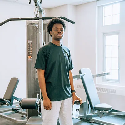 student wearing black Under Armour shirt