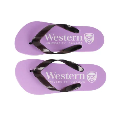 Purple flip flops with white "Western" script and the Crest logo screen printed on top of each flip flop.