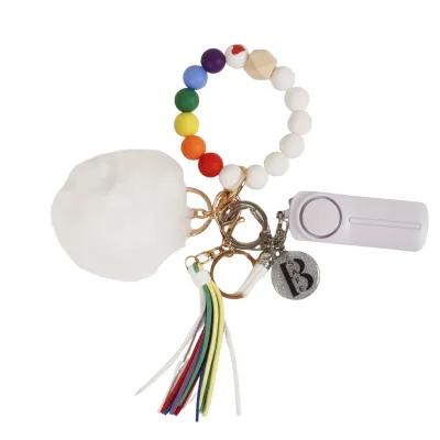White safety keychain with rainbow bracelet.