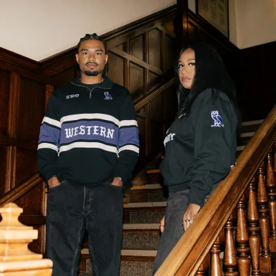 Two people posed on stairs