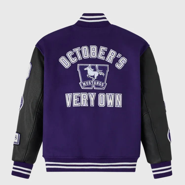 Purple Varsity jacket with leather black sleeves and embroidered patches. Back side view showing October's Very Own text and an Western Mustangs patch in purple and white script.