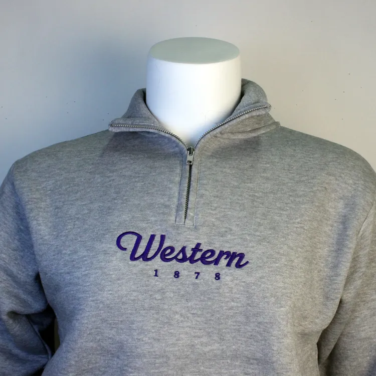 Heather grey 1/4 zip with Western 1878 embroidered in purple on the front of the garment.
