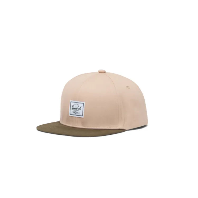 Beige and ivy green flat brimmed cap with the Hershel logo on the front.
