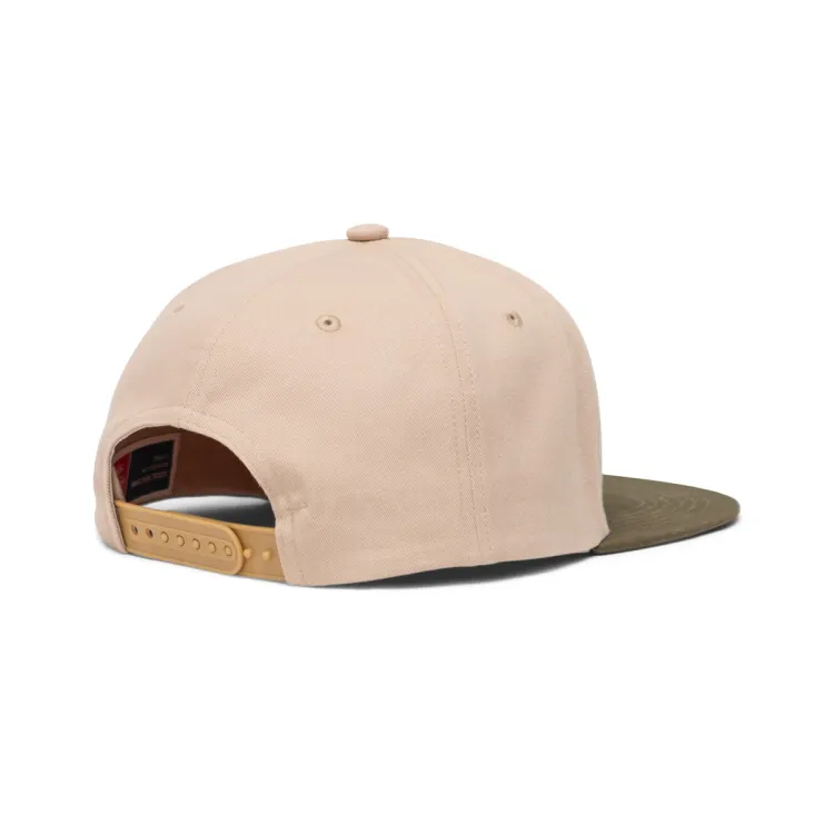 Beige and ivy green flat brimmed cap with the Hershel logo on the front.