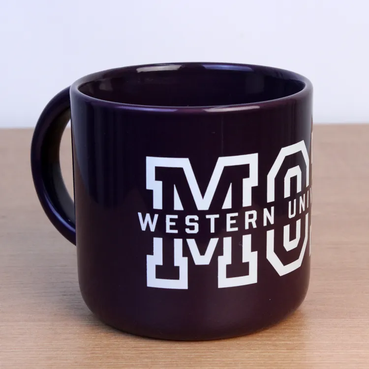 Purple mug with Western University Mom written on the front.