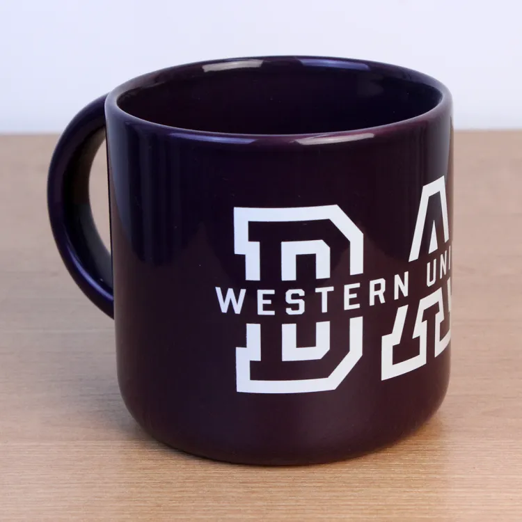 Purple mug with Western University Dad written on the front.