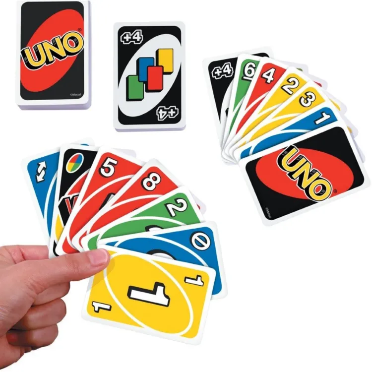 Uno Classic card game image of game play with cards fanning out of persons hand.