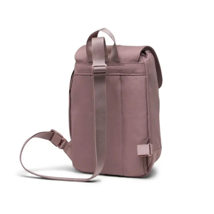 Muted pink Herschel retreat sling bag.