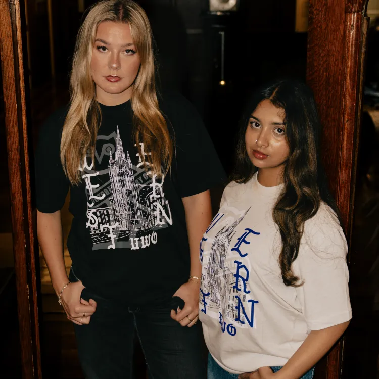 two girls standing in doorway