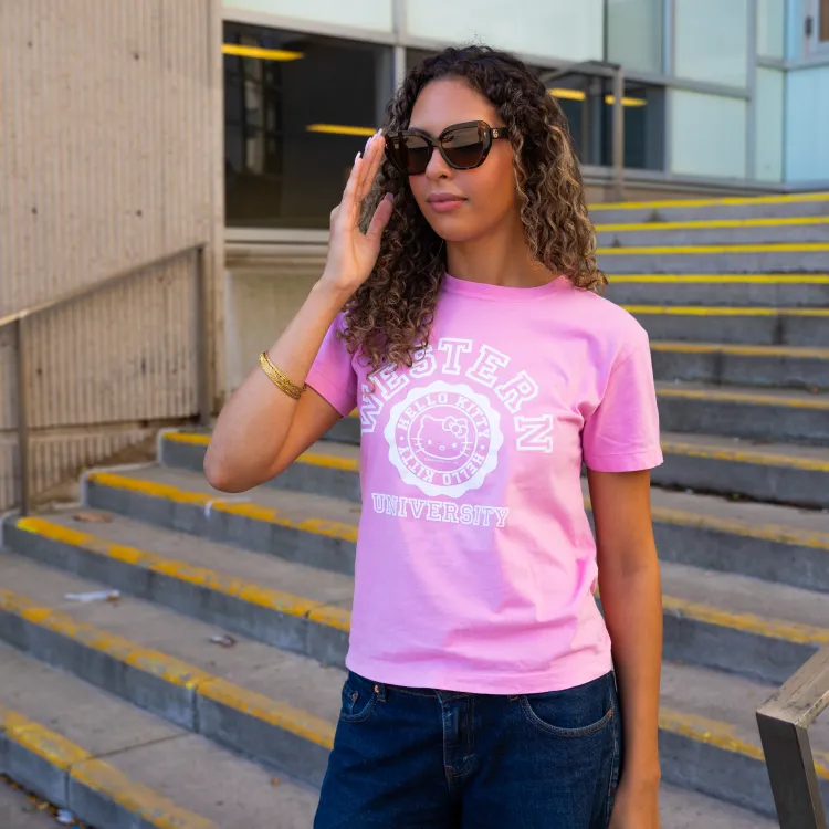 Girl wearing pink hello kitty shirt