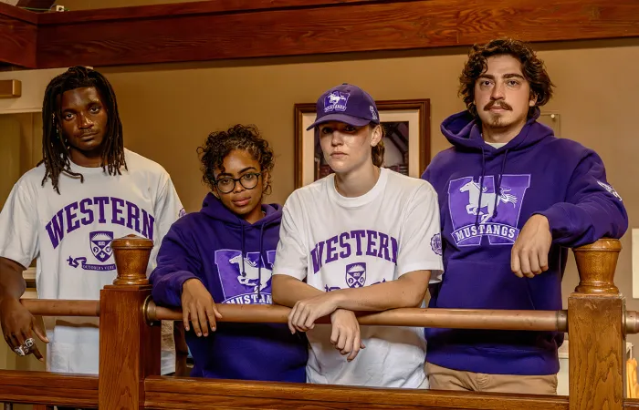 A group of people wearing western branded clothes