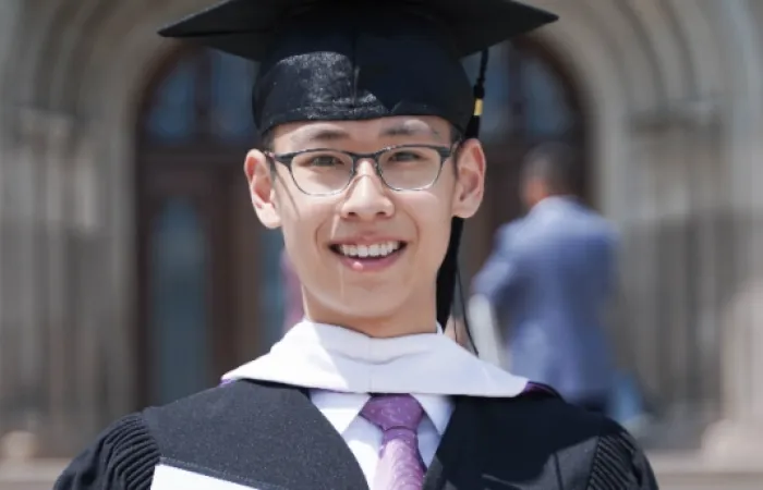 western student in convocation cap and gown