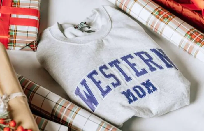 Western mom crewneck being wrapped