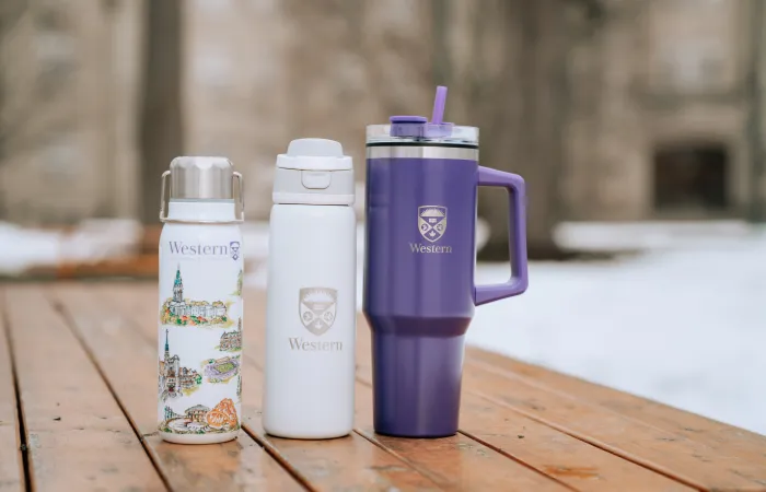 Western-branded drinkware on a picnic table