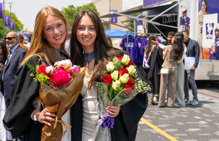 Students holding flowers