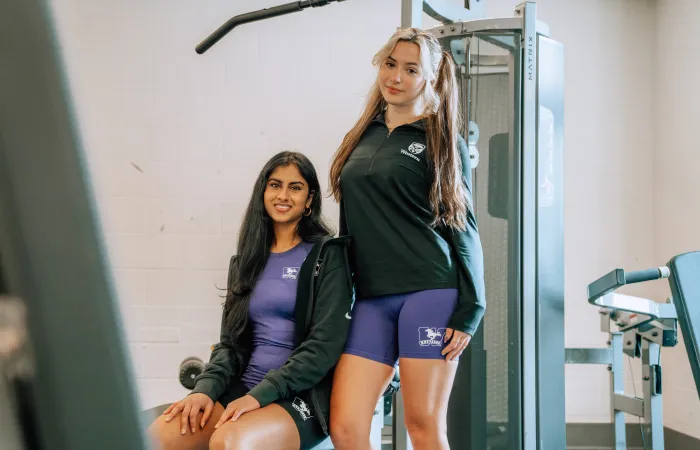 Girls in the gym wearing Nike clothing 