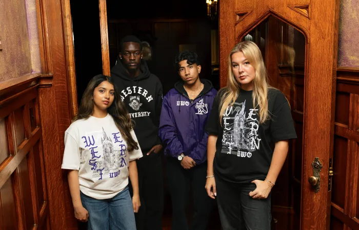 Models posed leaning in a doorway