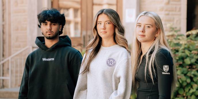 Three students wearing Western // lululemon merch