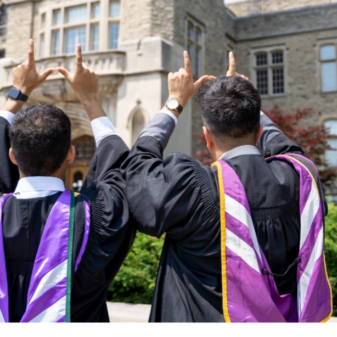 western students in purple graduation regalia