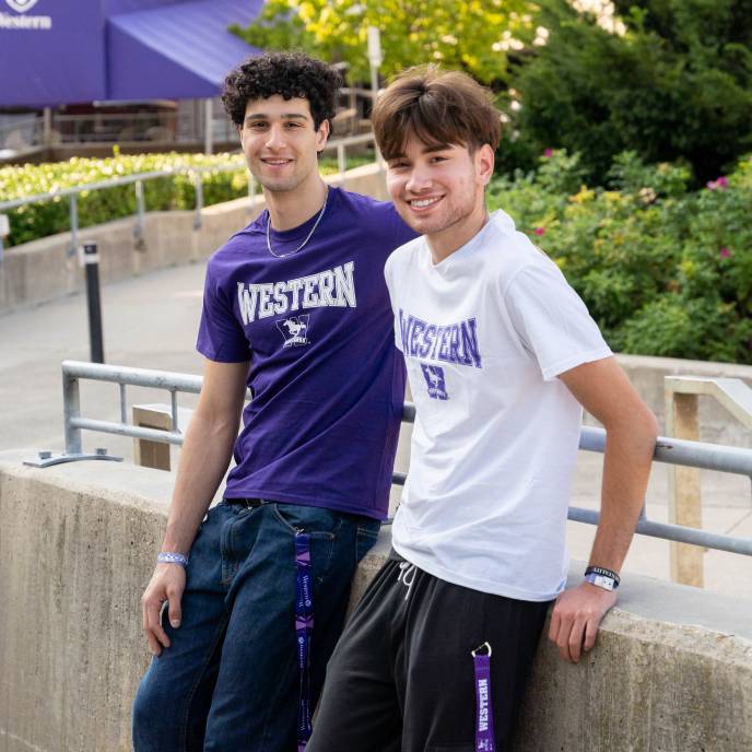 Two students in Western merch
